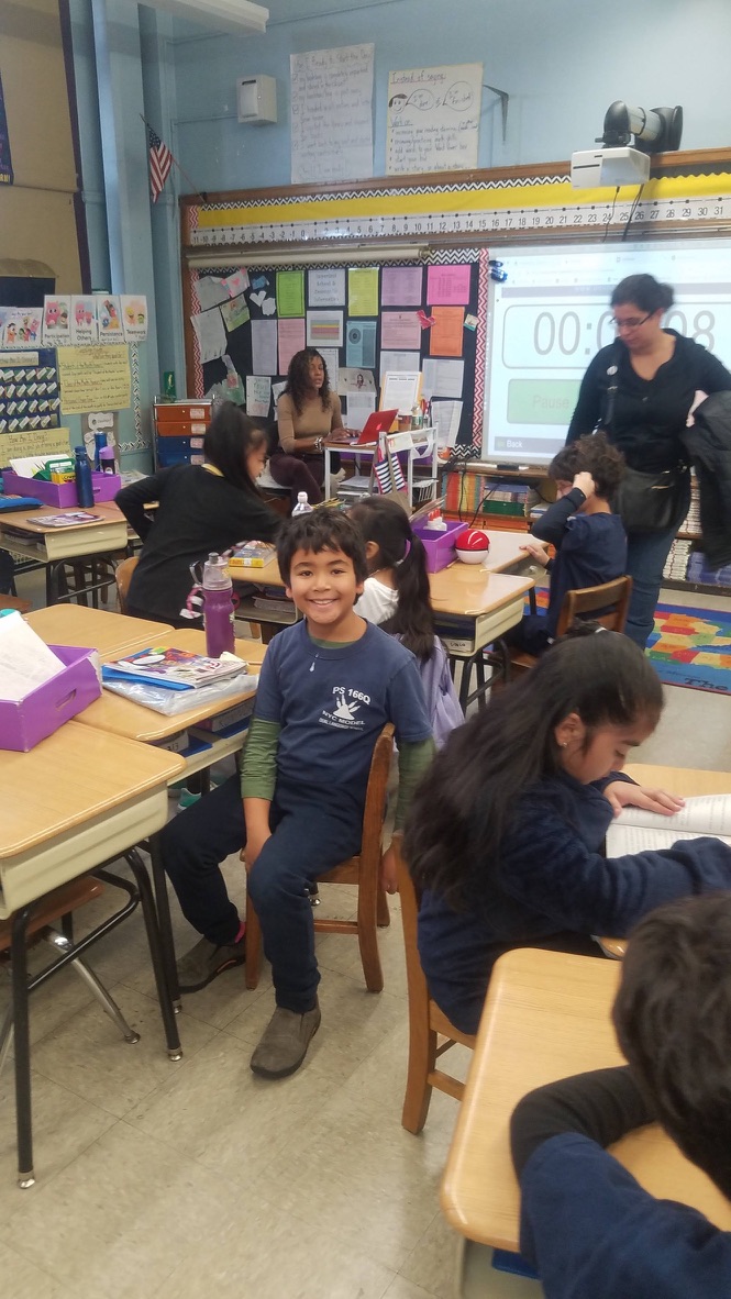 Konnor as a kid in elementary school classroom